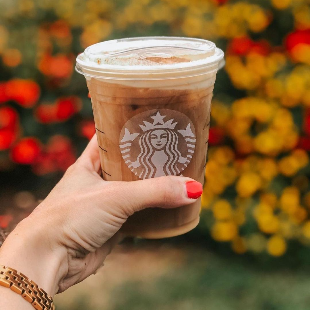 Starbucks Hand holding starbucks coffee